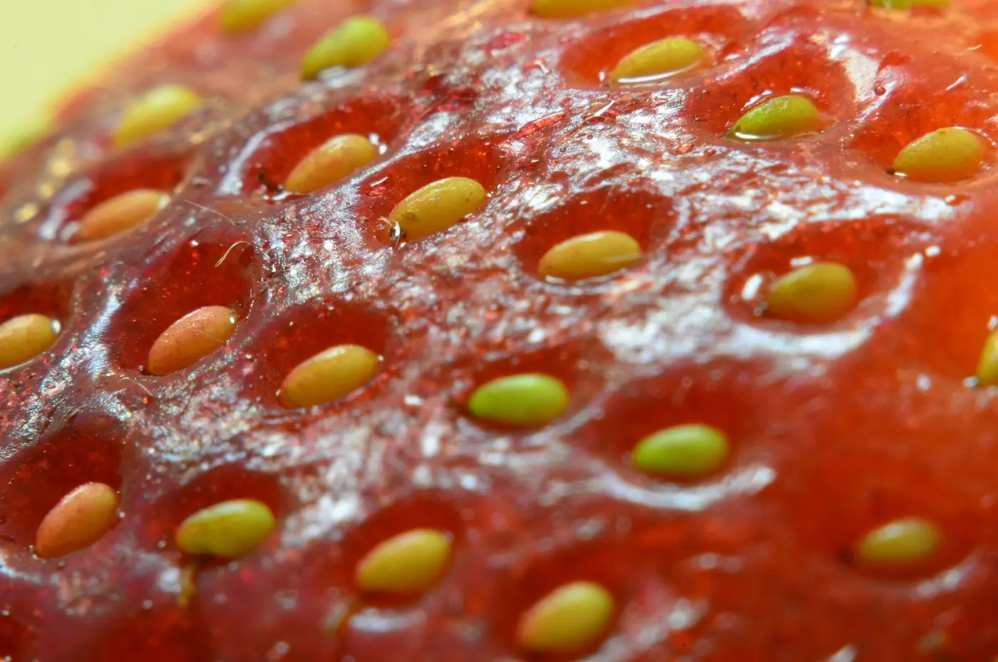 Close-up of a strawberry's surface with small yellowish seeds