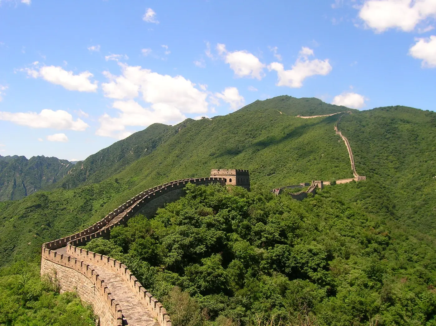 The Great Wall at Mutianyu winding over green hills