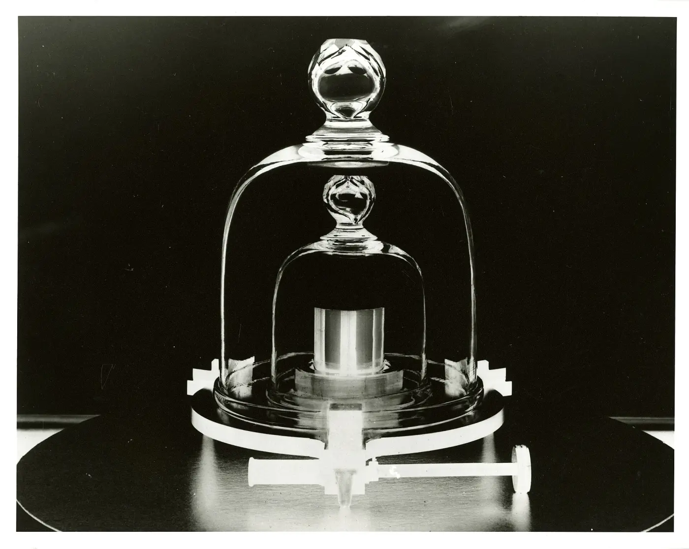 Replica of the kilogram prototype under two nested glass bell jars
