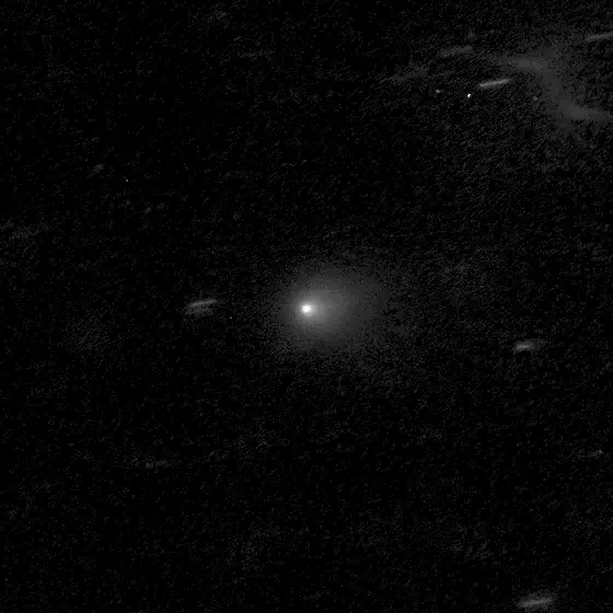 A blurry bright patch with a small bright core against a black sky: comet 3I/ATLAS, imaged by the Hubble telescope