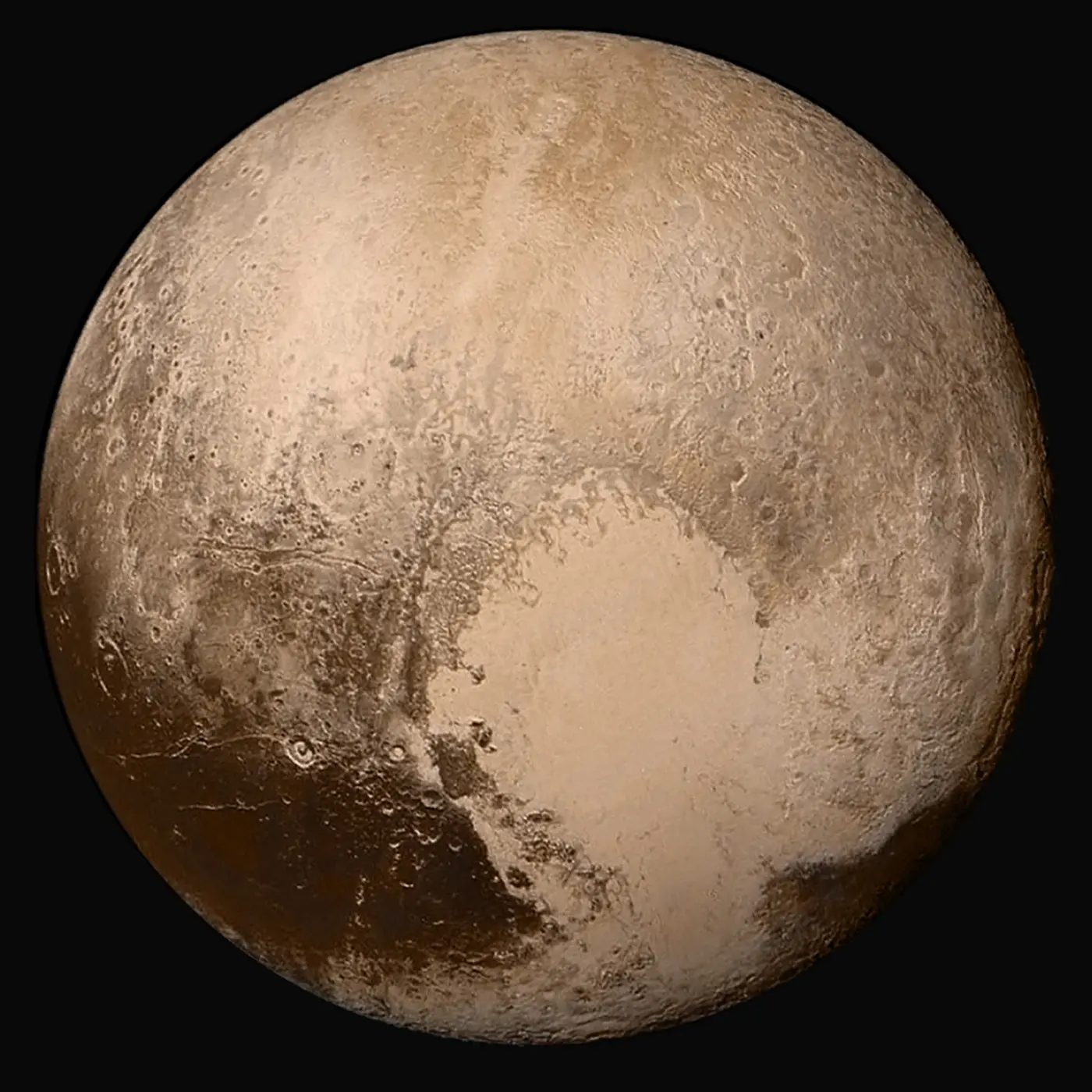 Pluto in colour: a beige-brown sphere with a bright, heart-shaped area