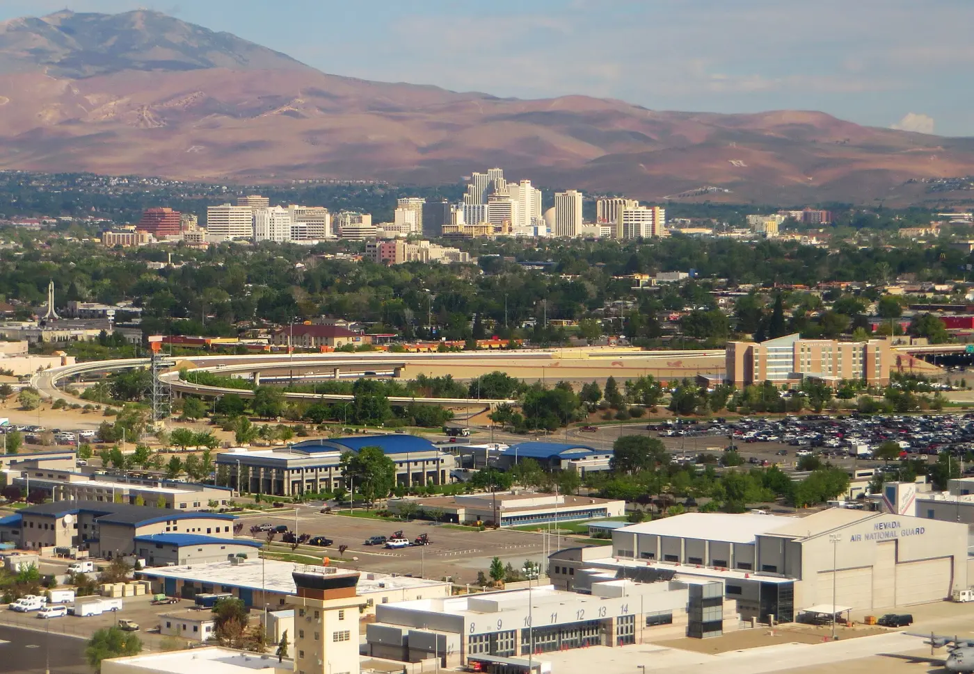 View over Reno with high-rises in front of brown mountains